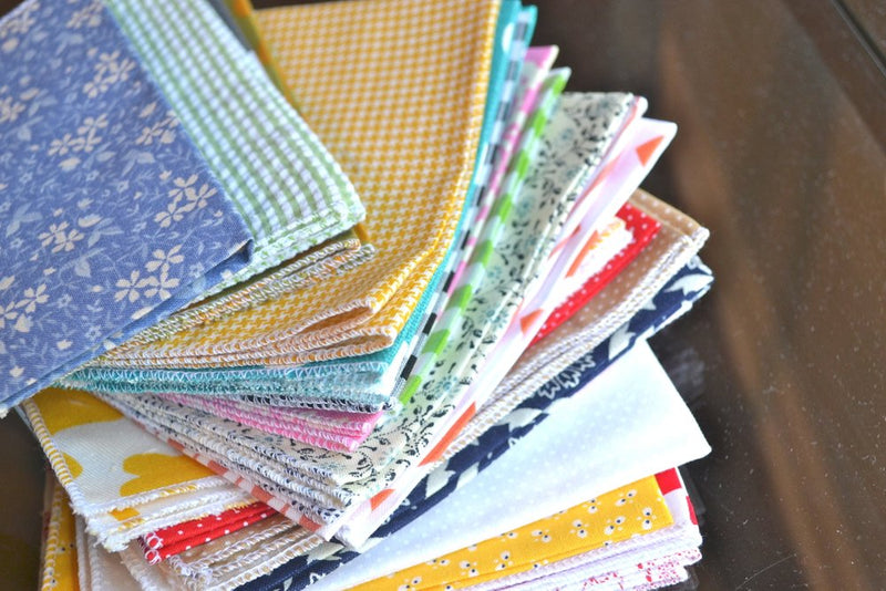 bargain stack of cloth napkins with variety of patterns