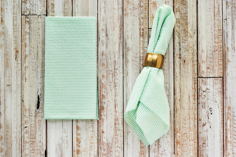 green colored seersucker cloth napkins on table
