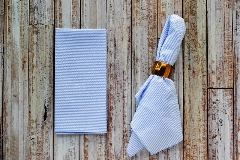 blue colored seersucker cloth napkins on table