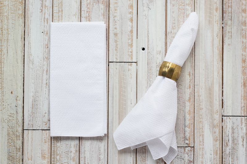 white colored seersucker cloth napkins on table